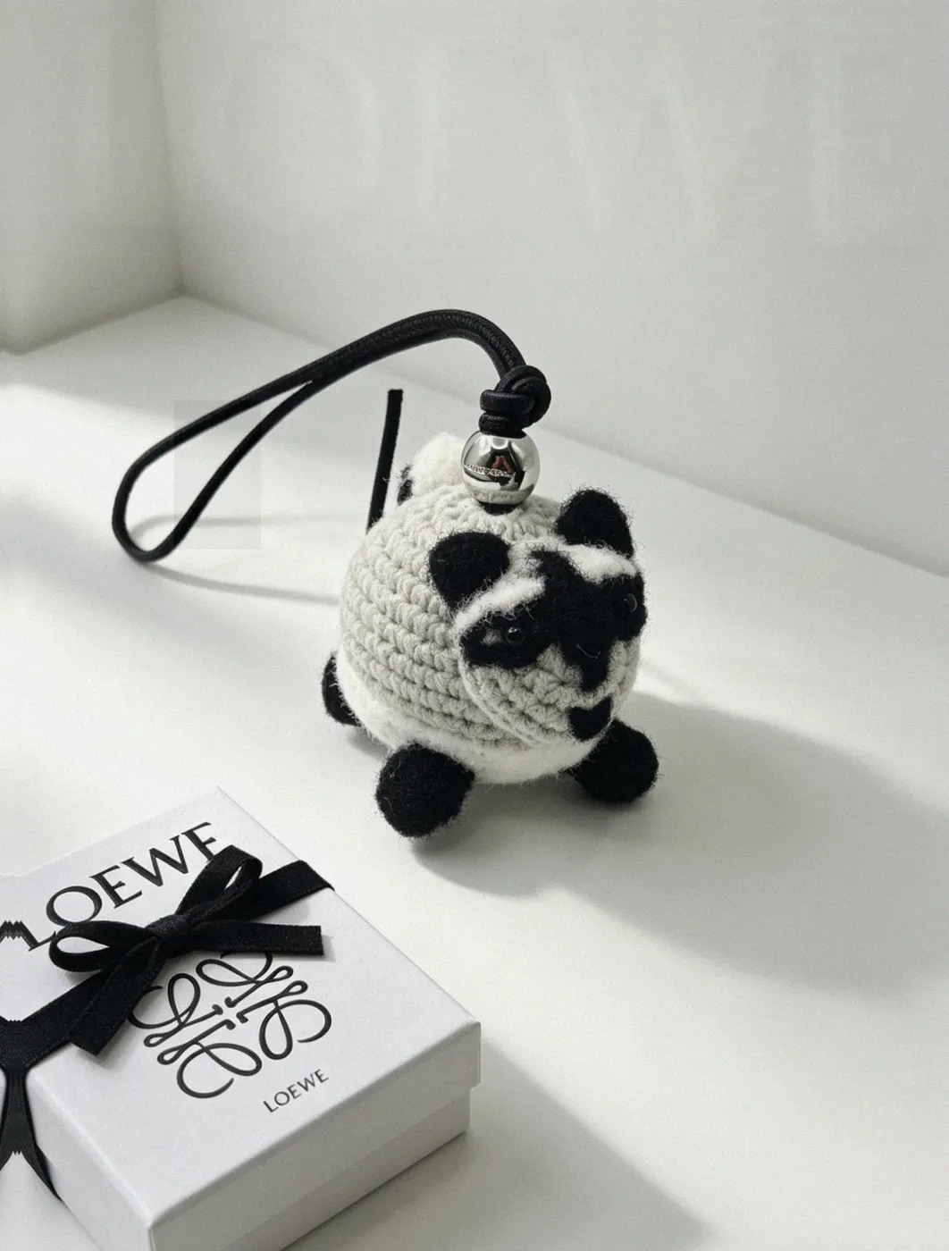 Counterfeit Loewe Raccoon Charm front view visual reference