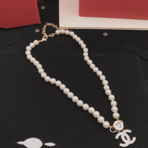 Counterfeit CHANEL jewelry detail view visual reference