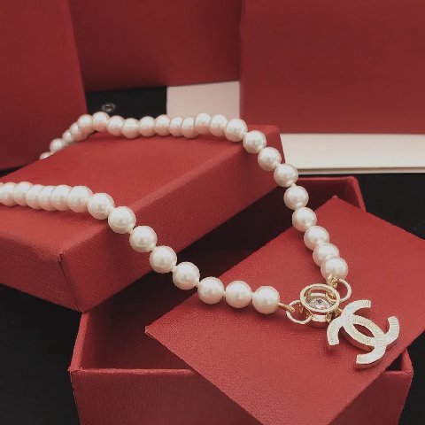 Counterfeit CHANEL jewelry detail view visual reference