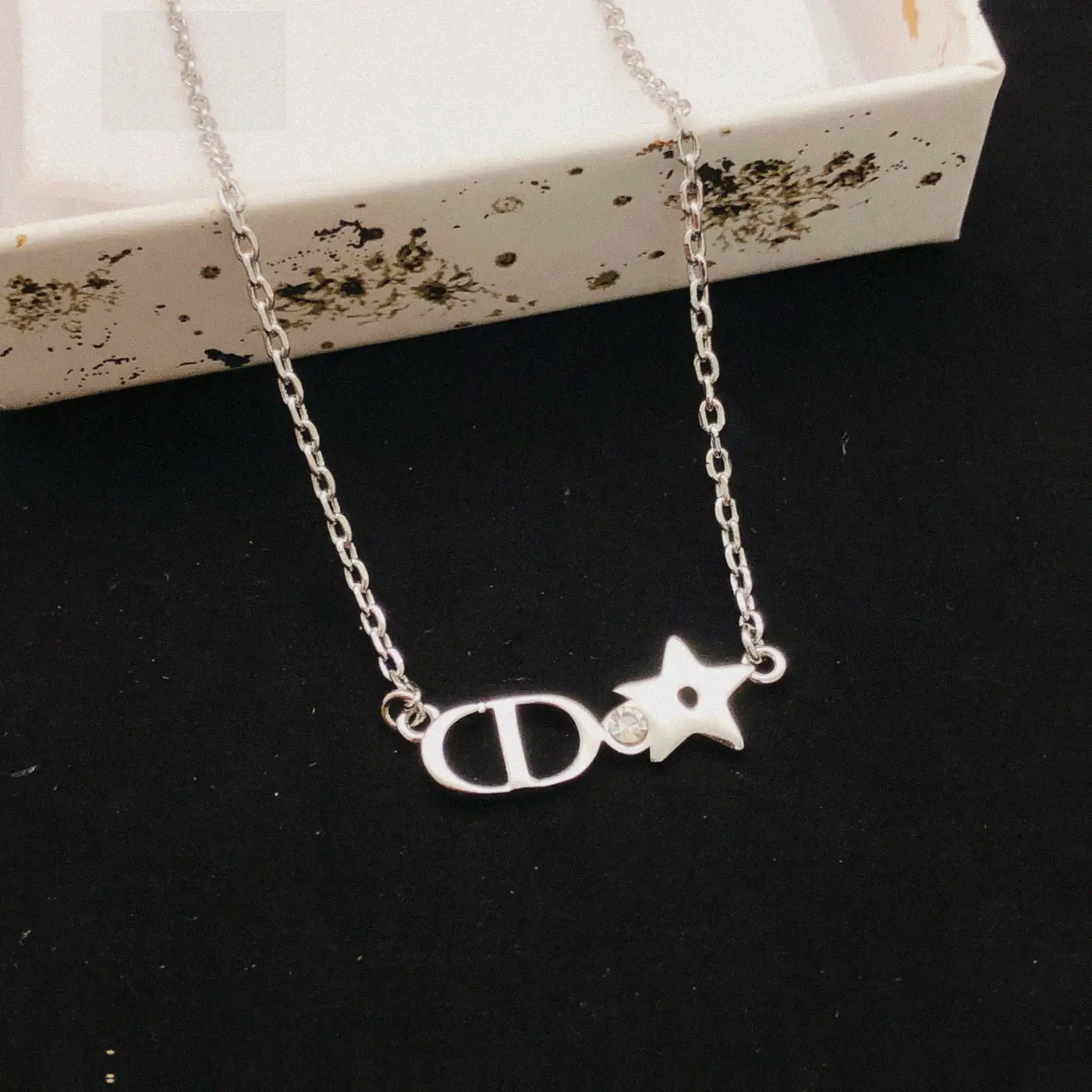 Counterfeit Dior jewelry front view visual reference