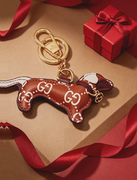 Counterfeit Gucci GG Emblem Dog Charm detail view visual reference