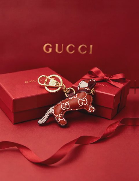 Counterfeit Gucci GG Emblem Dog Charm detail view visual reference