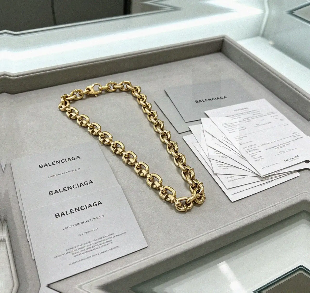 Counterfeit Balenciaga jewelry front view visual reference