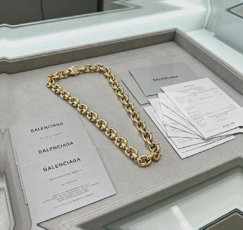 Counterfeit Balenciaga jewelry front view visual reference