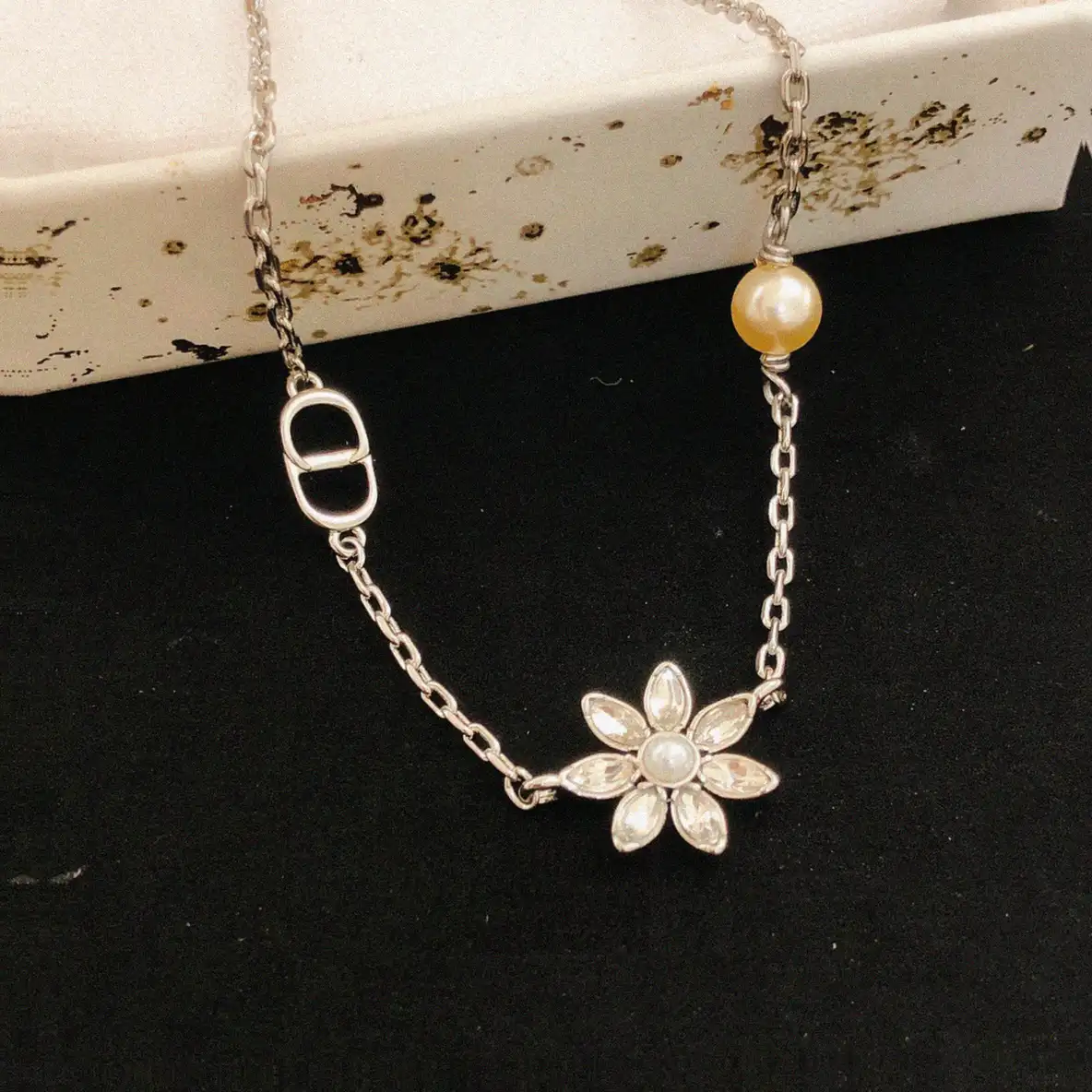 Counterfeit Dior jewelry front view visual reference
