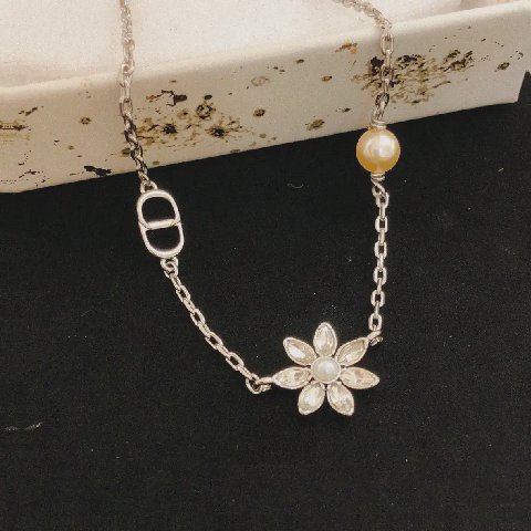 Counterfeit Dior jewelry front view visual reference