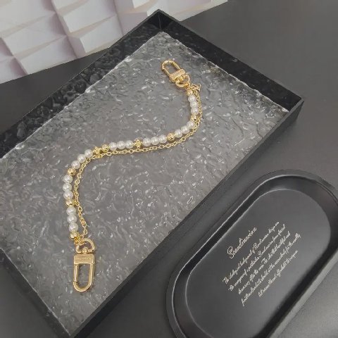 Counterfeit Louis Vuitton accessories detail view visual reference