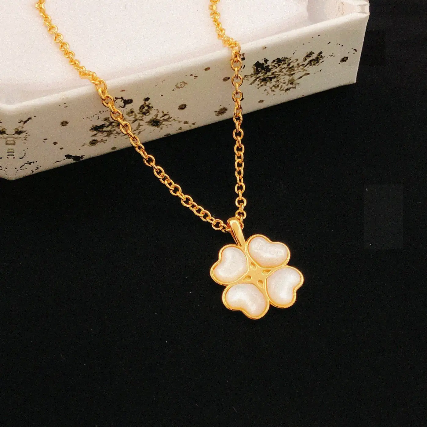 Counterfeit Dior jewelry front view visual reference